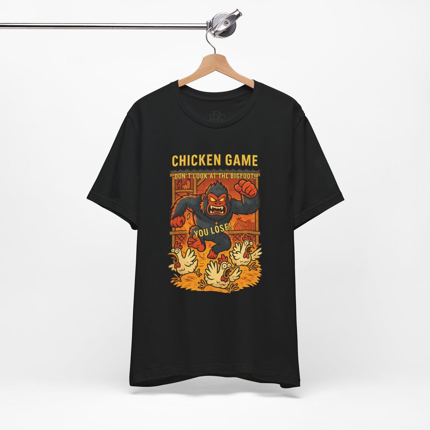 Bigfoot Chicken Game Tee – Humorous T-Shirt for Gamers & Cryptid Fans by Creative Artist Joe Parkhurst