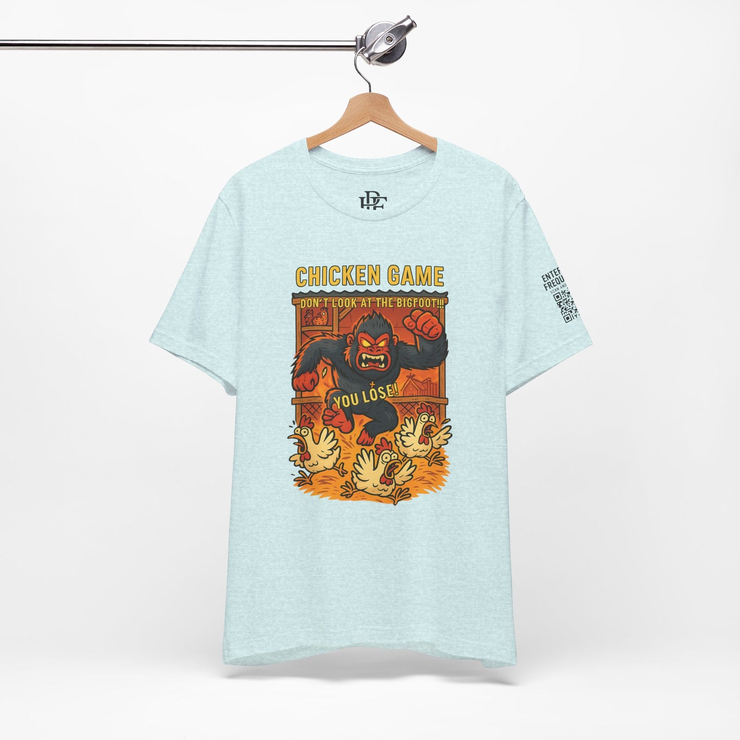 Bigfoot Chicken Game Tee – Humorous T-Shirt for Gamers & Cryptid Fans by Creative Artist Joe Parkhurst